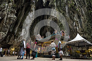 Tourists seen exploring and praying in the Hindu Temple, Batu Caves, Malaysia.