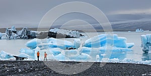 Tourists on the shore of Jokulsarlon Glacier Lagoon.