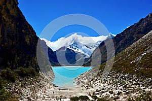 Tourists on the shore of Laguna Paron, Peru