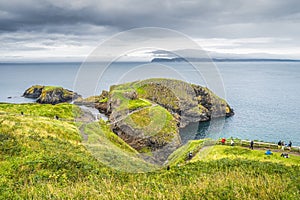 Tourists sightseeing the Carrick a Rede rope bridge, Northern Ireland