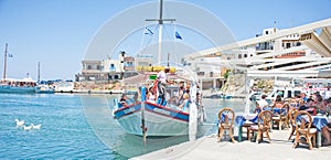 Tourists in Sissi harbor, Crete.