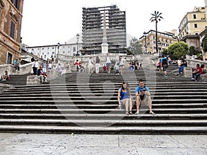 Tourists sitting on the Spanish Steps. Rome