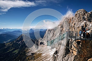 Tourists at skywalk bridge in Dachstein, Austria