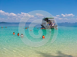 Tourists snorkeling in Andaman sea at Ko Kradan Island, Thailand