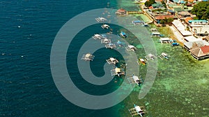 Tourists snorkeling in coral reef, Moalboal, Philippines