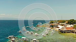 Tourists snorkeling in coral reef, Moalboal, Philippines