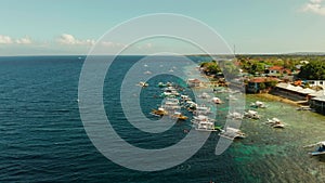 Tourists snorkeling in coral reef, Moalboal, Philippines