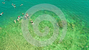 Tourists snorkeling in the lagoon, Philippines, El Nido.