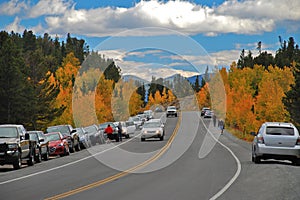 Tourists stop their cars along Colorado`s Peak to Peak Highway, a Scenic Byway, to take in the Fall Colors