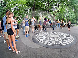 Tourists at Strawberry Fields in Central Park in New York