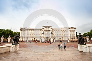 Tourists strolling in front of Buckingham Palace, London, England