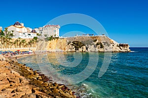 Tourists sunbathers in Benidorm old town beach Mal Pas, Spain