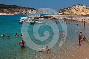 Tourists swimming on beautiful and crystalline sea of Isole Tremiti