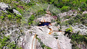 Tourists swimming, relaxing and arriving at Conceicao dos Gatos Waterfall.