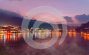 Tourists take a boat on lake at Ban Rak Thai village in morning , Mae Hong Son province, Thailand. Yunnan Chinese community