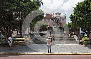 Tourists take pictures in front of the simon bolivar monument in casco viejo panama city