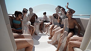 Tourists take a ride on tourist boat tour on beach in Durres, Albania