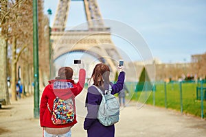 Tourists taking picture of the Eiffel tower