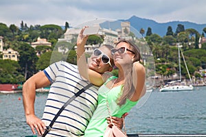 Tourists taking a picture in France with their phone