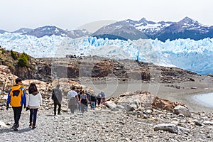 Tourists in a tour at Perito Moreno Glacier, located in the Los Glaciares National Park, Patagonia Argentina.