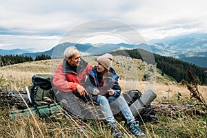 Tourists traveling through the mountains. friends at a halt during a trip to the mountains. Copy space.