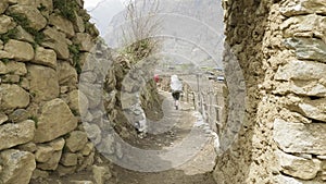 Tourists on the trek around mountain Manaslu, near village Prok, Nepal.