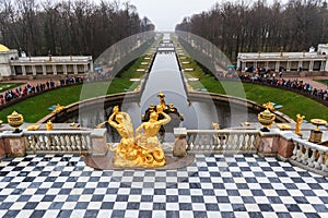 Tourists visit The Peterhof Palace garden.