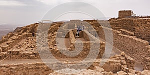 Tourists Visit the Storerooms Complex at the Masada in Israel photo
