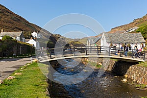 Tourists visiting Boscastle North Cornwall England UK between Bude and Tintagel on sunny blue sky day