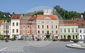 Tourists visiting Brasov historic quarter