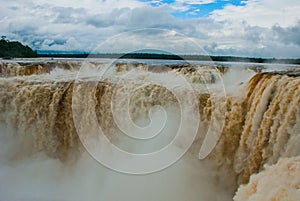 Tourists visiting the Devil s throat waterfall in the Iguazu Falls, one of the seven natural wonders of the world. Missions,