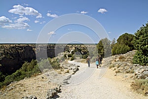 Tourists visiting the Hermitage of San Frutos on a cliff over the river Duraton in Segovia, Spain. photo