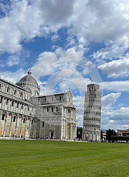 Tourists visiting leaning tower of Pisa and miracle square