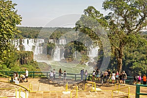 tourists at viwepoint above Iguacu river, at Iguacu falls, Brazil