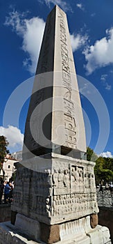 Tourists walk by the Egyptian obelisk in  Hippodrome