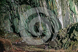 Tourists walking around deer cave at Gunung Mulu national park. Sarawak.