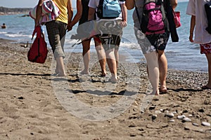 Tourists walking on beach