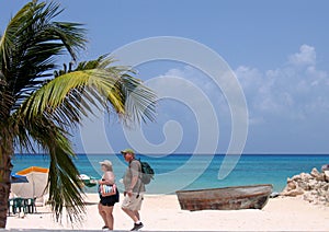 Tourists walking on beach