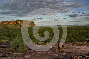 tourists walking down from the Nadab Lookout in ubirr, kakadu national park - australia, northern territory