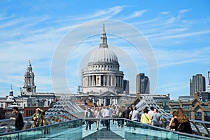 Tourists walking on milenium bridge in London