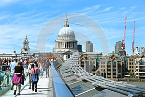 Tourists walking on milenium bridge in London