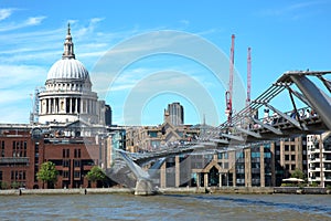 Tourists walking on milenium bridge in London