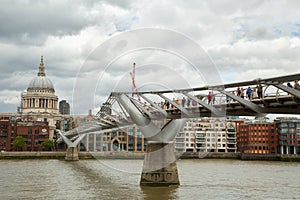 Tourists walking on milenium bridge in London