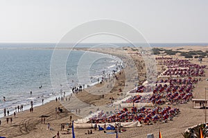 Beaches of Playa del Ingles with tourists photo