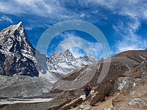 Tourists walking on the road to Everest Base camp in Sagarmatha National Park, Nepal Himalaya