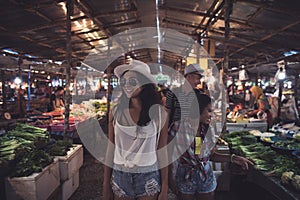 Tourists Walking Between Rows On Tropical Exotic Market Young People Choosing Fresh Fruits And Vegetables In Asian