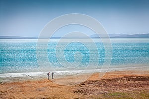 Tourists walks on the shore of Styfe Golu solt lake.