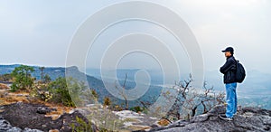 Tourists watch the atmosphere, sky and clouds above the Mekong mountain at Pha Chanadai, Thailand