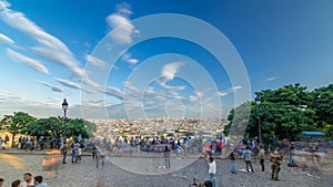 Tourists watching Paris panorama from Montmartre timelapse. View of the city from hill viewpoint.