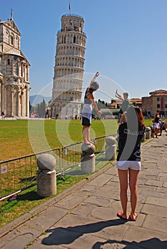 Tourists were mimicking the action of pushing Leaning Tower of Pisa Staight